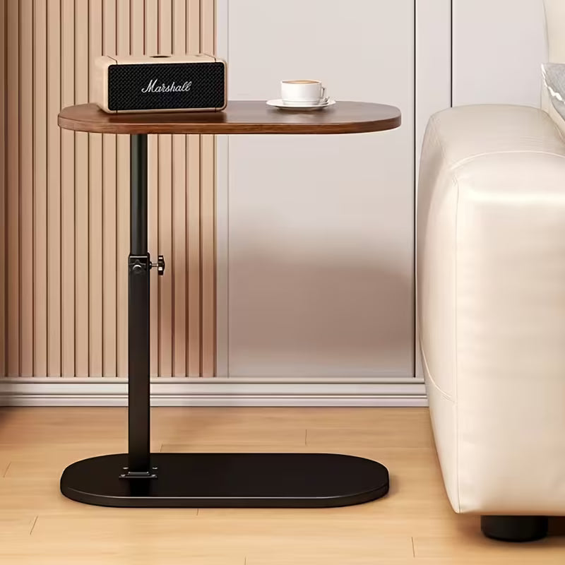 Portable 360-degree rotating C-shaped wood top sofa side table holding a book, coffee cup, and phone.
